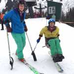 Outdoor Recreation and Community Access (ORCA) adaptive instructors Megan Ahleman and Sean O'Neill demonstrate how to use stand-up outriggers and a mono ski, adaptive equipment Southeast Alaska Independent Living (SAIL)'s ORCA program had on hand for Adaptive Day with Eaglecrest Ski Area on Jan. 17.