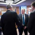 Gov. Bill Walker and Lt. Gov. Byron Mallott, left, receive a ceremonial visit by Rep. Matt Claman, D-Anchorage, second from left, and Rep. Lance Pruitt, R-Anchorage, after the House gaveled into session on the first day of the 29th Legislature at the Capitol in Juneau on Tuesday, Jan. 19, 2016.