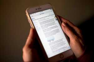 In this Wednesday, Dec. 30, 2015 photo, a page from IRS.gov regarding IRS electronic filing information for a direct deposit of a refund is displayed on a mobile phone screen in Los Angeles. Electronic filing was up 2.4 percent in 2015 from 2014. Similarly, the use of direct deposit for refund checks also is gaining in popularity.  (AP Photo/Jae C. Hong)