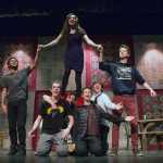 Lead bride, Millie, as played by Lydia Smith, sings with her new husband Adam's six brothers. In this memorable dance scene, Millie teaches the brothers how to court a lady.  The brothers, from left to right, are Christ Talley, Brandon Hard, Marcellin Niset, Ian Scholl, Dylan Rice, and Josh Rivers.