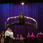 Chris Talley does a split jump from Seven Brides for Seven Brothers' big dance number, called "the Challenge Dance."