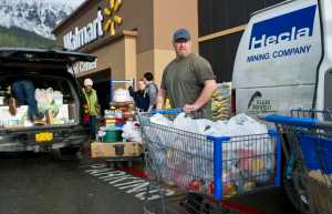 Darren Adams, manager of the Southeast Alaska Food Bank, takes advantage of the store-closing sales at Walmart to buy thousands of pounds of food for the Southeast Food Bank on Friday.