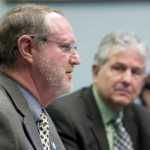 Steven Hatter, Deputy Commissioner for the Department of Transportation and Public Facilities, left, and Jerry Burnett, Deputy Commissioner of the Department of Revenue, speak to SB 132 in front of Senate Transportation Committee at the Capitol on Tuesday.
