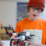 Ambrose Bucy, 13, explains how he built the main body of the robot for his team's recent Lego League competitions.
