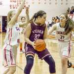 Ketchikan's Eliah Anderson does her best to keep her ball from the Crimson Bears on Friday night.