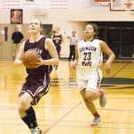 The Kings' Eliah Anderson knows she has almost out run JDHS Tona Fogg with her eyes on that basket.
