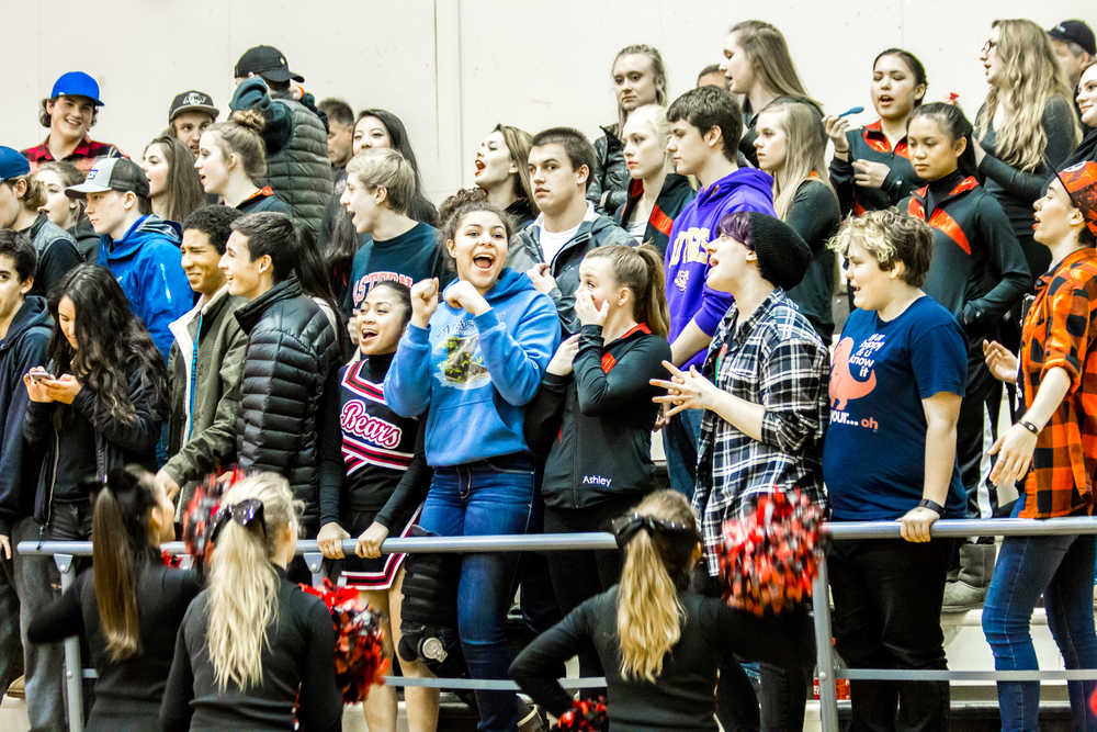 The Crimson Cheerleaders get the crowd pumped for the game Friday night against Ketchikan.