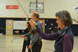 Anne Sutton, foreground, practices a flyfishing cast in a 2014 flyfishing class taught by Raincountry Flyfishers president Tony Soltys.