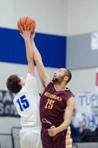 Thunder Mountain's Noah Reishus-O'Brien jumps against Kayhi's Mo Bullock during their game Friday night at TMHS. Ketchikan won 76-65.