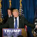 Republican presidential candidate, businessman Donald Trump speaks to supporters during a primary night rally, Tuesday, Feb. 9, 2016, in Manchester, N.H. At his side are his wife Melania Trump, left, and daughter Ivanka Trump, right. (AP Photo/David Goldman)