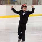 A skater celebrates at the Juneau Skating Club's 11th Annual Basic Skills competition on Sunday.