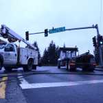 A telephone wire for 700 Juneau phone lines is sprawled across the left turn lane on Vintage Drive Wednesday after an Arrow Refuse truck's garbage lift hooked on the line, bringing it down and traffic to a stop.