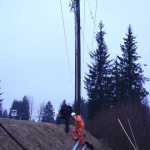 Alaska Communications employees assess damage to a phone line that an Arrow Refuse driver brought down with his truck Wednesday. The incident took place on the corner of Vintage Boulevard and Riverside Drive, making left turns onto Riverside impossible after Juneau Police Department officers shut down traffic in that direction.