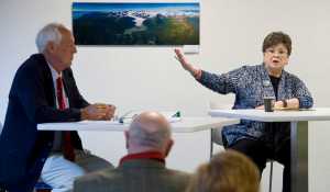 Juneau mayorial candidates Karen Crane and Ken Koelsch answer questions during a forum held by the Downtown Business Association in the Senate Building on Friday.