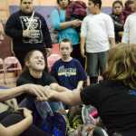 Two Glacier Valley Elementary students compete for first place in the Stick Pull during the Native Youth Olympics at Riverbend on Friday.