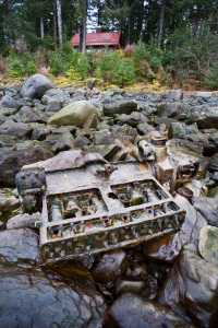 The rusted remains of a six-cylinder, 1928 Buick engine, sits on the beach in front of Ernest Gruening's cabin near Amalga Harbor. The engine powered the the Ark of Juneau, a boat built by the Satko family that brought them to Juneau in the summer of 1938.