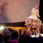 Amy George models artist Lauralye Miko's Tech-eggcolor Par-eggdise, made with more than 5000 chicken, duck, emu and turtle eggs, at the Wearable Art 2014 show at Centennial Hall.