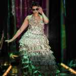 Hanna Davis models her "Two for the Show" made of lots of money, mostly $2 bills, at the Wearable Art Extravaganza 2016 at Centennial Hall on Sunday.