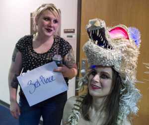 Artist Lauralye Miko, left, watches as model Amy George displays her "Southeast Seawolf" made of nautical charts, halibut line, barnacles, coral and seaglass at the Wearable Art Extravaganza 2016 at Centennial Hall on Sunday.