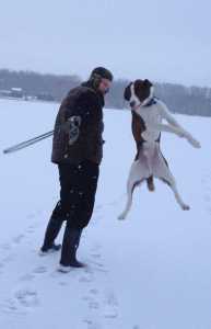 Sundown Arasmith, 40, is shown here playing with his 2-year-old dog Mason. Alaska State Troopers found Arasmith's body Saturday along with his friend Arnold Jongsma, 60, after a kayaking accident. Family members are continuing to search for the dog and a kayak the men used for their trip to Shelter Island.