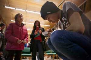 In this Feb. 12 photo, performer Byron Nicholai signs his album for fans after a performance at the University of Alaska Southeast in Juneau.