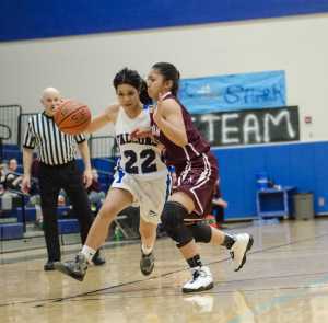 Thunder Mountain's Siniva Maka drives against Ketchikan's AJ Dela Cruz during their game Friday night at TMHS. Ketchikan won 53-37.