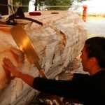 Haida carver TJ Young, who lives in Anchorage, has been in Sitka working on the canoe almost every day since the project started. (National Park Service | Erin Fulton)