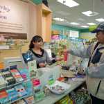 Hallmark Gold Crown store manager Daricka Clark helps customer Manuel Guillen with a card purchase in the Nugget Mall on Tuesday. The store is to close at the end of March after the owner could not find a buyer.