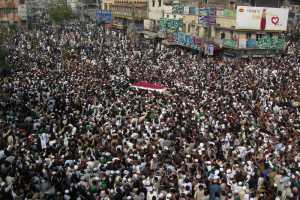 Thousands of people move with an ambulance carrying the body of police officer Mumtaz Qadri, the convicted killer of a former governor, during funeral prayers Tuesday in Rawalpindi, Pakistan.