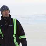 This Feb. 9 photo shows Steve Thatcher, the Alpine operations manager for ConocoPhillips, standing on an ice bridge near the CD5 drilling site on Alaska's North Slope.