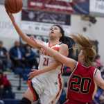 Yakutat's Dani Go lays the ball up against Klawock's Ashley Huffine during the 1A Region V Basketball Championship game at Thunder Mountain High School on Friday. Klawock won 37-35.