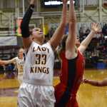 Ketchikan's Courtney Kemble (33) shoots as Juneau-Douglas' Cristina Aehart defends Friday afternoon during the 4A championship game at the Region V Tournament in Sitka.
