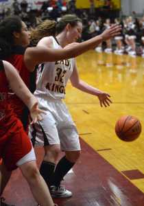 Juneau Douglas' Tona Fogg (23) defends as Ketchikan's Eliah Andaerson (32) gets a pass Friday afternoon during the 4A championship game of the Region V Tournament in Sitka.