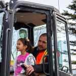 Four-year-old Kiana Twitchell gets to run a backhoe with an IUOE Local 302 Operators Union as her copilot.