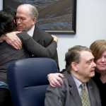 Gov. Bill Walker, left, hugs Kara Nelson, director of Haven House, as Rep Geran Tarr, D-Anchorage, right, contratulates Sen. Johnny Ellis, D-Anchorage, after the Governor signed Senate Bill 23 at the Capitol on Monday. The bill gives public access to the life-saving heroin antidote called Naxolone.