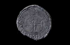 This undated photo made available by Blue Water Recoveries company on Tuesday, March 15, 2016 shows a rare silver coin called an Indio discovered from the debris of the explorer Vasco da Gama's ship, Esmeralda which sank in a storm in May 1503 off the coast of Al Hallaniyah island in Oman's Dhofar region. (Blue Water Recoveries company via AP)