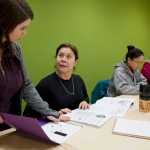 Patricia Zeballos, originally from Chile, receives instruction from Felicite Toney, left, during an English as a Second Language class at the Mendenhall Valley Public Library last month. The Learning Connection provides ESL and immigration courses for free. Along with Zeballos are students Chayanin Corcoran, center, of Thailand, and Sarah Jane de Torres, of the Philippines.