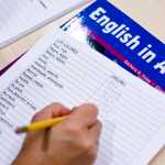 A student works on naming colors from Spanish to English during a English as a Second Language class at the Mendenhall Valley Public Library.