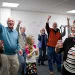 Ken Koelsch, second from left, and his wife, Marian, right, celebrate his win for mayor during a party in the Senate Mall building on Tuesday.