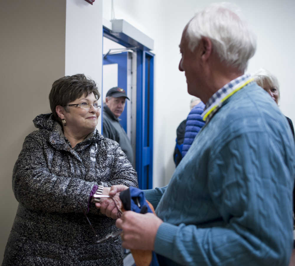 Karen Crane greets Ken Koelsch as she exits Assembly Chambers on Tuesday.
