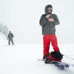 Snowboarder Derek Eby, right, takes a break from hiking to the top of the Eaglecrest Ski Area as skier John Wilcock skins up on Wednesday.