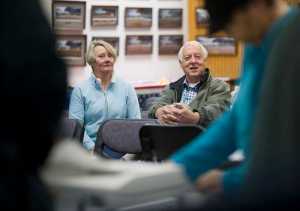 Ken Koelsch and his wife, Marian, watch election workers count the remaining absentee and questioned ballots from Tuesday's special mayoral election in Assembly Chambers on Friday. Koelsch maintained his lead over opponent Karen Crane. The Canvass Review Board meets Tuesday to verify the results from the precincts and to certify the election.