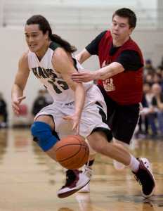 Haines' Ryan Harms is grabbed by Hydaburg's Tyrell Edenshaw during their "B" bracket game in the 2016 Juneau Lions Club 70th Gold Medal Basketball Tournament at Juneau-Douglas High School on Monday.