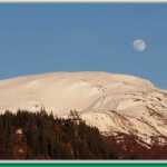 Moon and sun over Mt. Roberts.