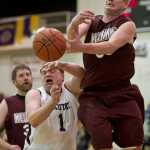 Klukwan's Jesse McGraw passes against Yakutat's Sean Jocelyn during their C bracket game in the 2016 Juneau Lions Club 70th Gold Medal Basketball Tournament at Juneau-Douglas High School on Tuesday.