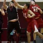 Hoonah's David Lindoff, left, rebounds against Kake's Dylan Lee, center, and Dion Jackson during their B bracket game in the 2016 Juneau Lions Club 70th Gold Medal Basketball Tournament at Juneau-Douglas High School on Tuesday.