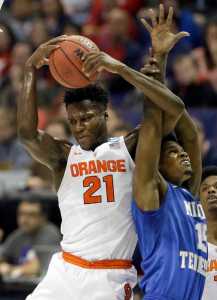 In this March 20 photo, Syracuse's Tyler Roberson, left, and Middle Tennessee's Aldonis Foote reach for a rebound during a second-round game in the NCAA Tournament, in St. Louis.