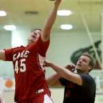 Kake's Dion Jackson rebounds over Wrangell's Graham Gablehouse during their B bracket game in the 2016 Juneau Lions Club 70th Gold Medal Basketball Tournament at Juneau-Douglas High School on Wednesday.