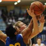 Juneau's Erik Kelly puts up a shot against Bartlett's Ethan Falaniko.