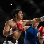 Ixtlán del Río, Mexico's Luis Garcia attempts to hit his challenger, Juneau's Michael Engel, during their fight Friday night at the AK Beatdown at Centennial Hall. Michael Engel won the match.